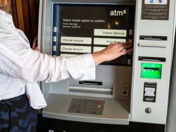 Young Woman at an ATM machine